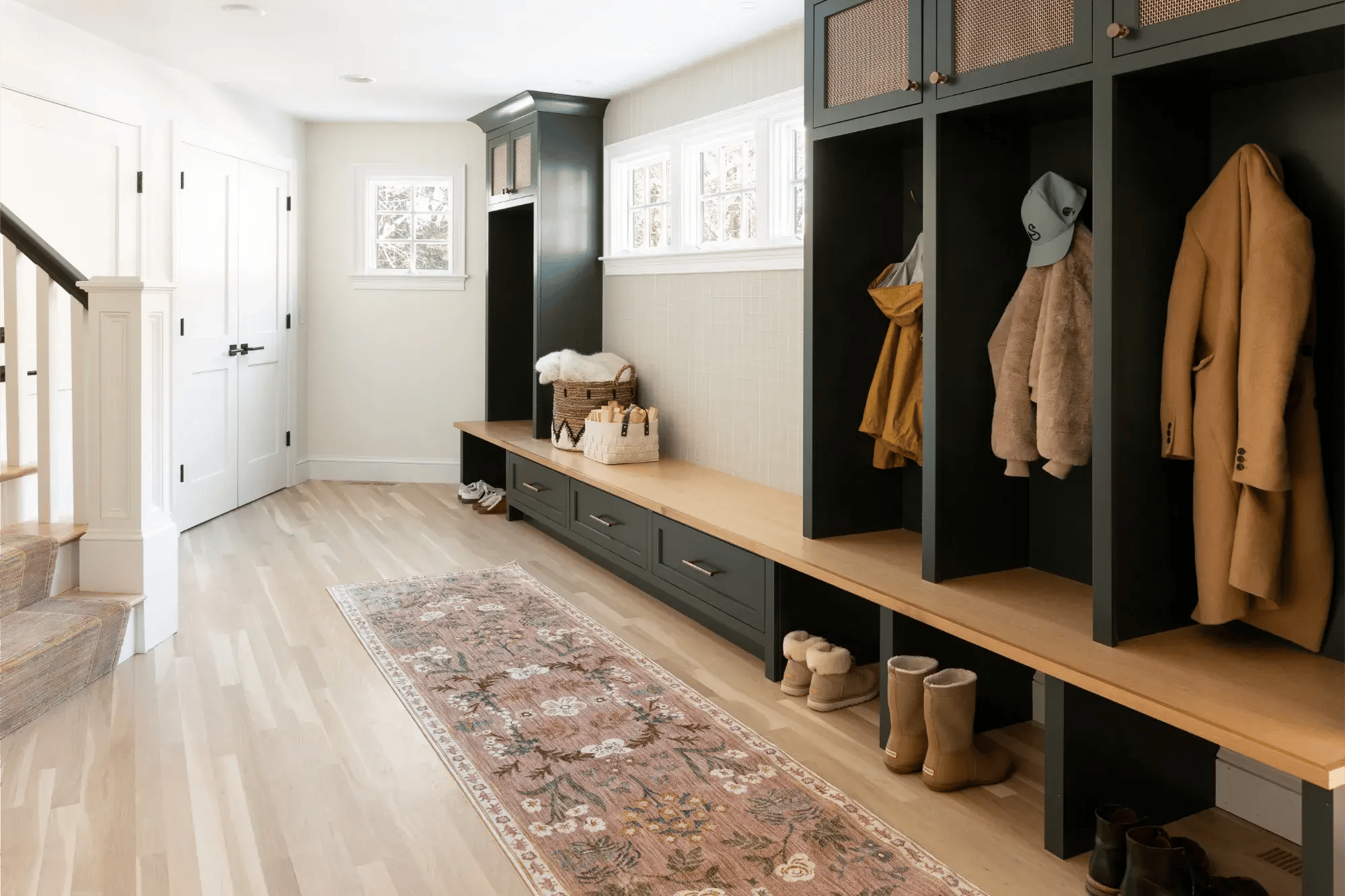 Spacious Home Renovation featuring green storage cubbies and seating area