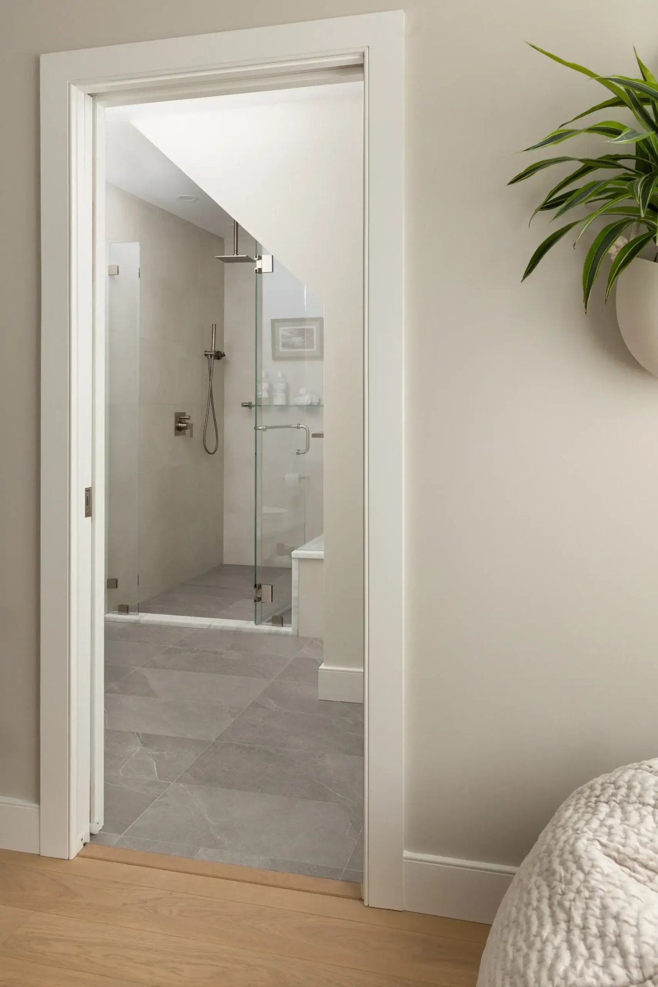 View through doorway to modern glass shower bathroom in Greater Boston View through doorway to modern glass shower bathroom in Greater Boston