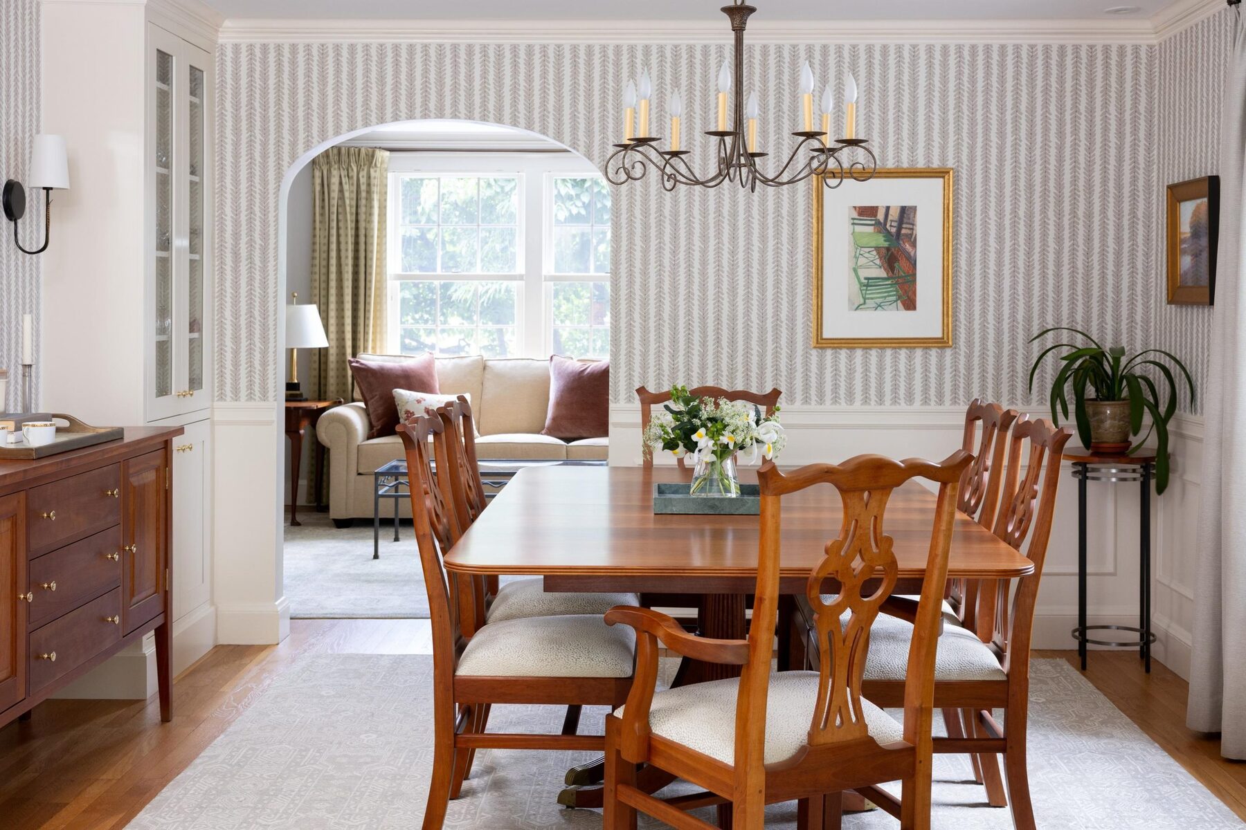 Traditional dining room with wood table and chandelier in Greater Boston