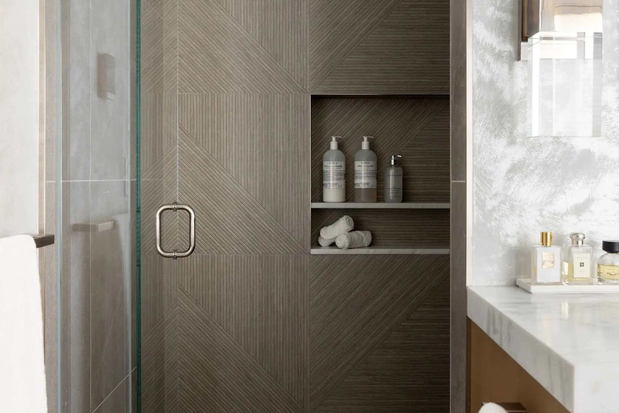close up of built-in storage in cool neutral bathroom in Boston, MA
