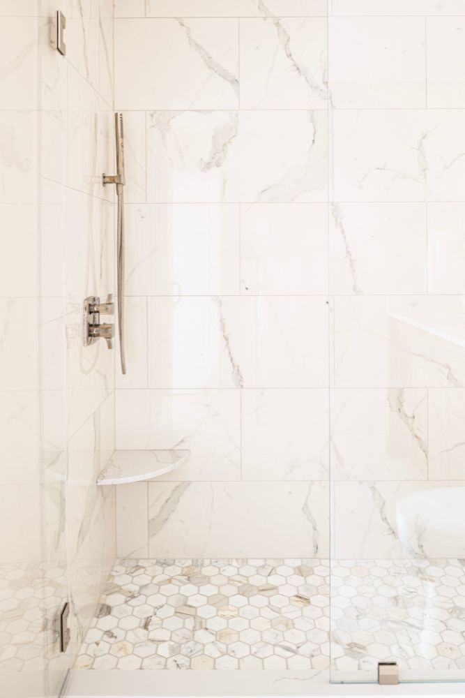 marble tile shower condo renovation